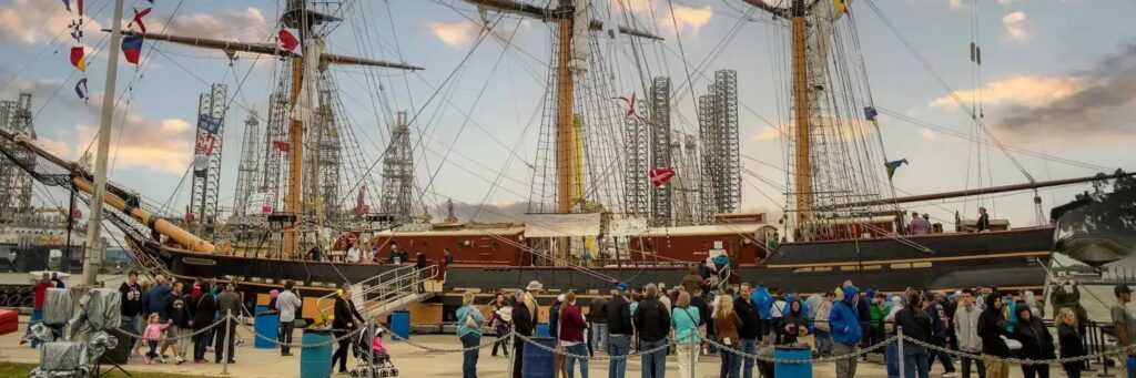 Crowd of people in front of Tall Ships in Galveston